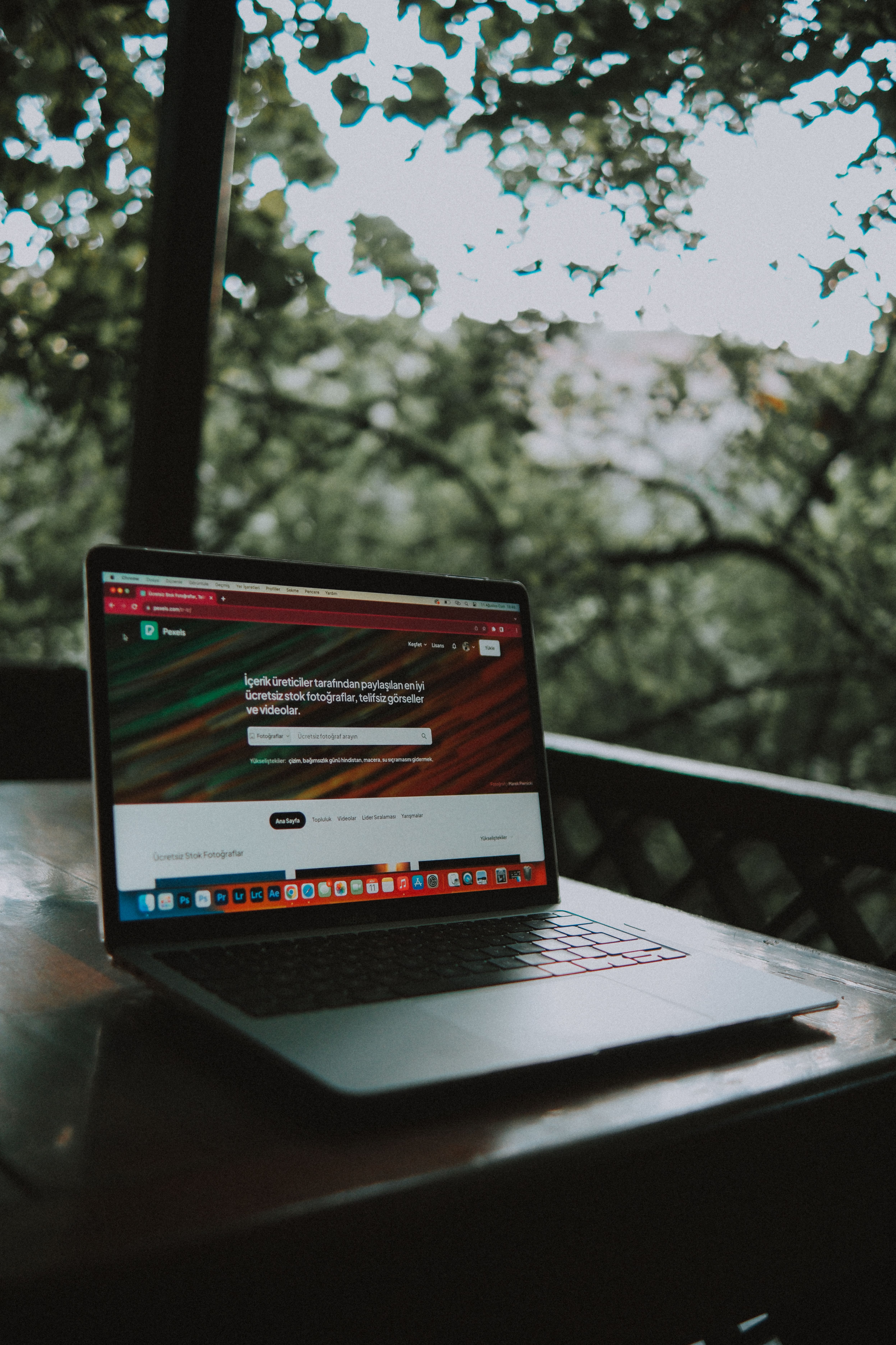 Content operator working on a laptop outdoors